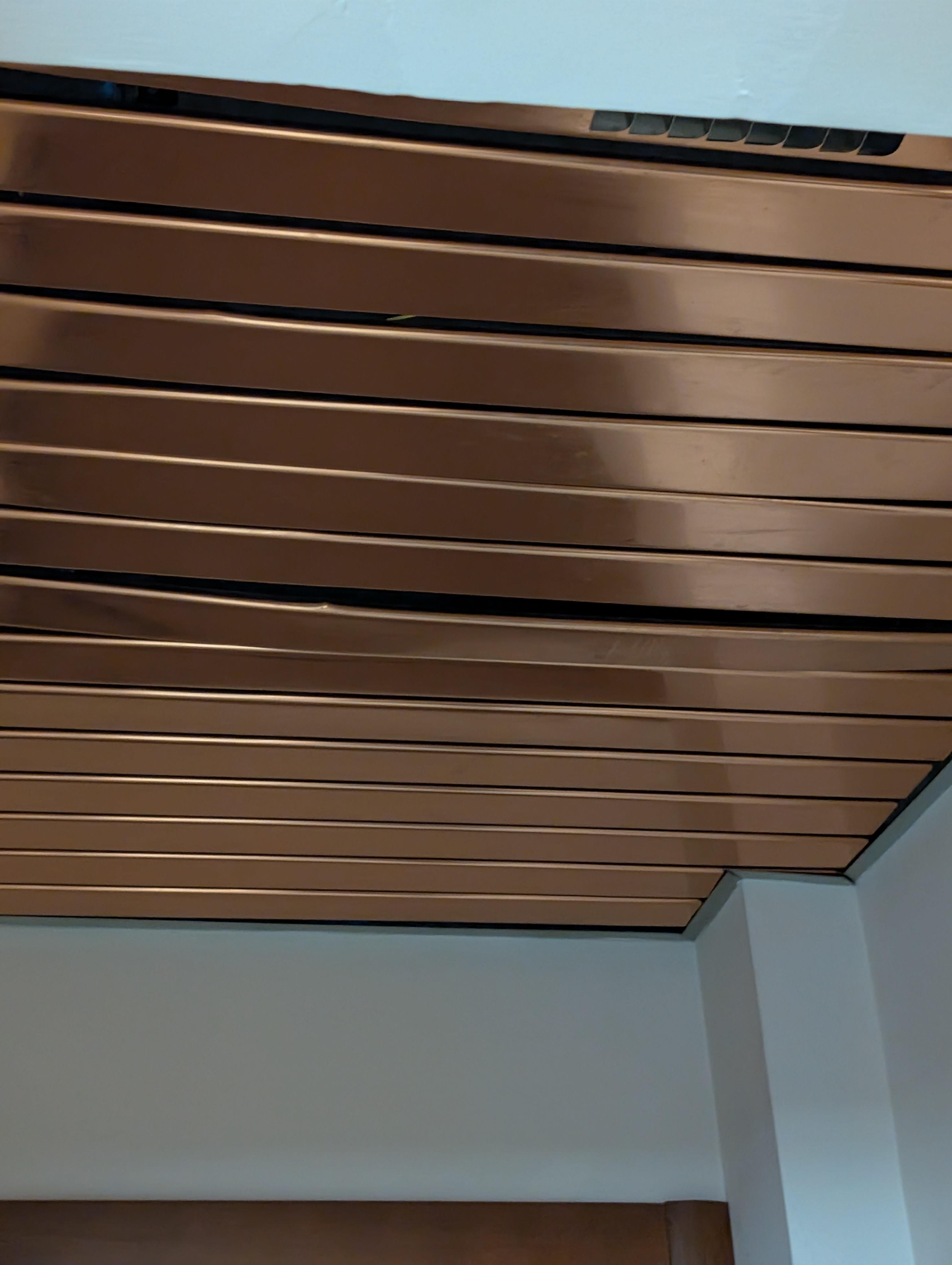 Ceiling in entry way defective or poorly repaired.