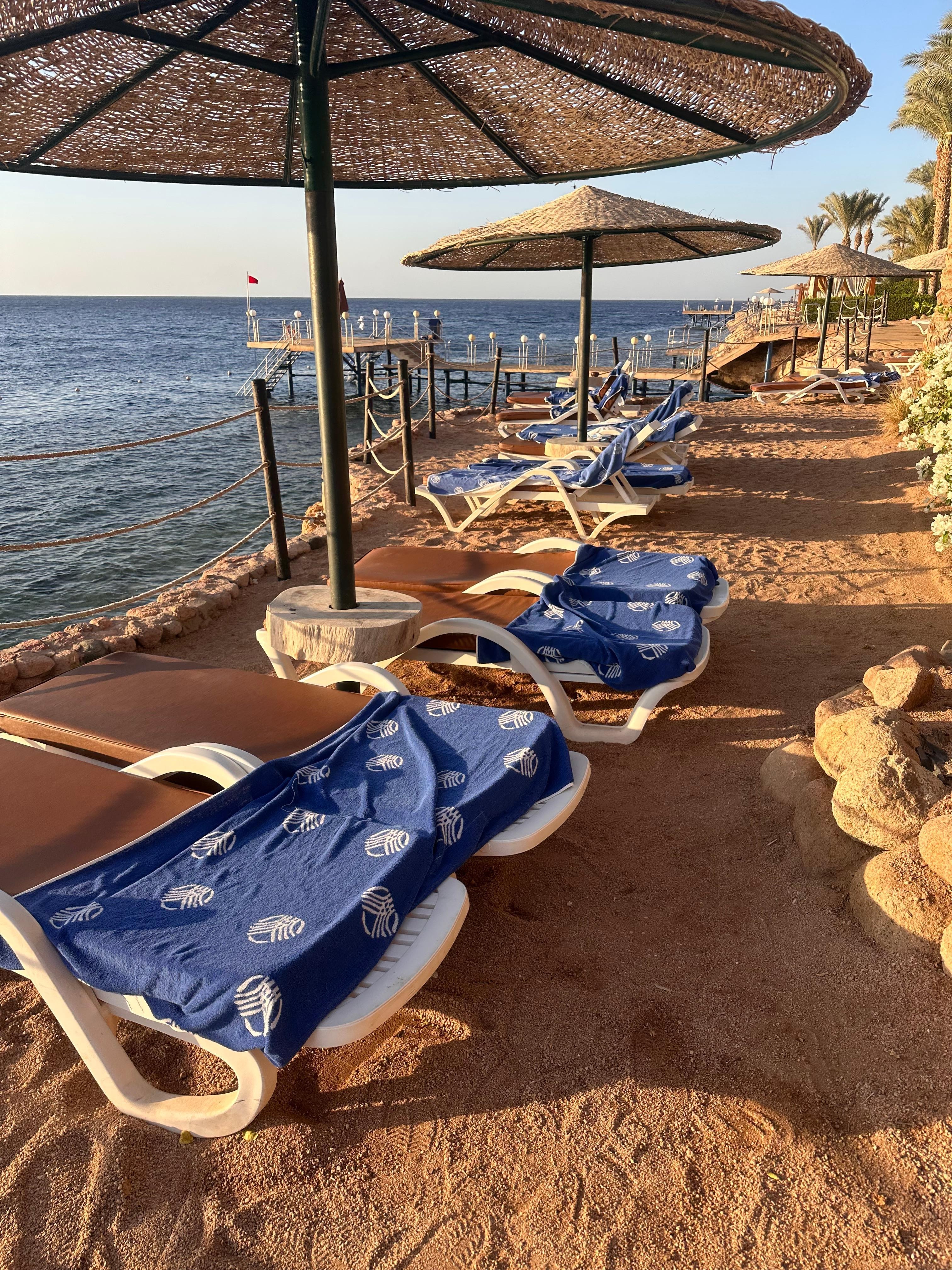 Sun loungers reserved with towels and left unused for many hours. 
