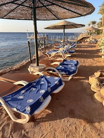 Sun loungers reserved with towels and left unused for many hours.