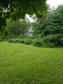 View of us walking to the house from the back you can see it on the road