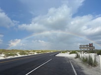 Caught a rainbow driving into the park!