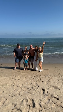 Family photo on the beach at the house!