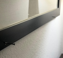 Screws were sticking out of the photo frames in the wall - very dangerous to trip into