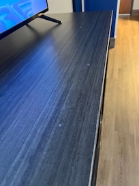 Something spilled on tv stand.