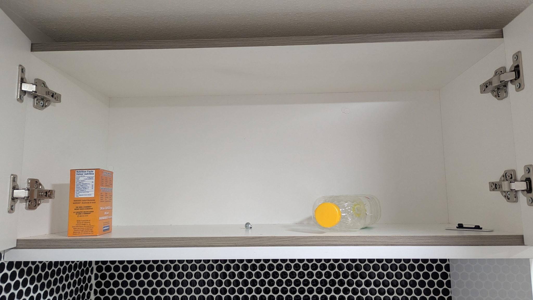 Empty containers left behind in cabinets.