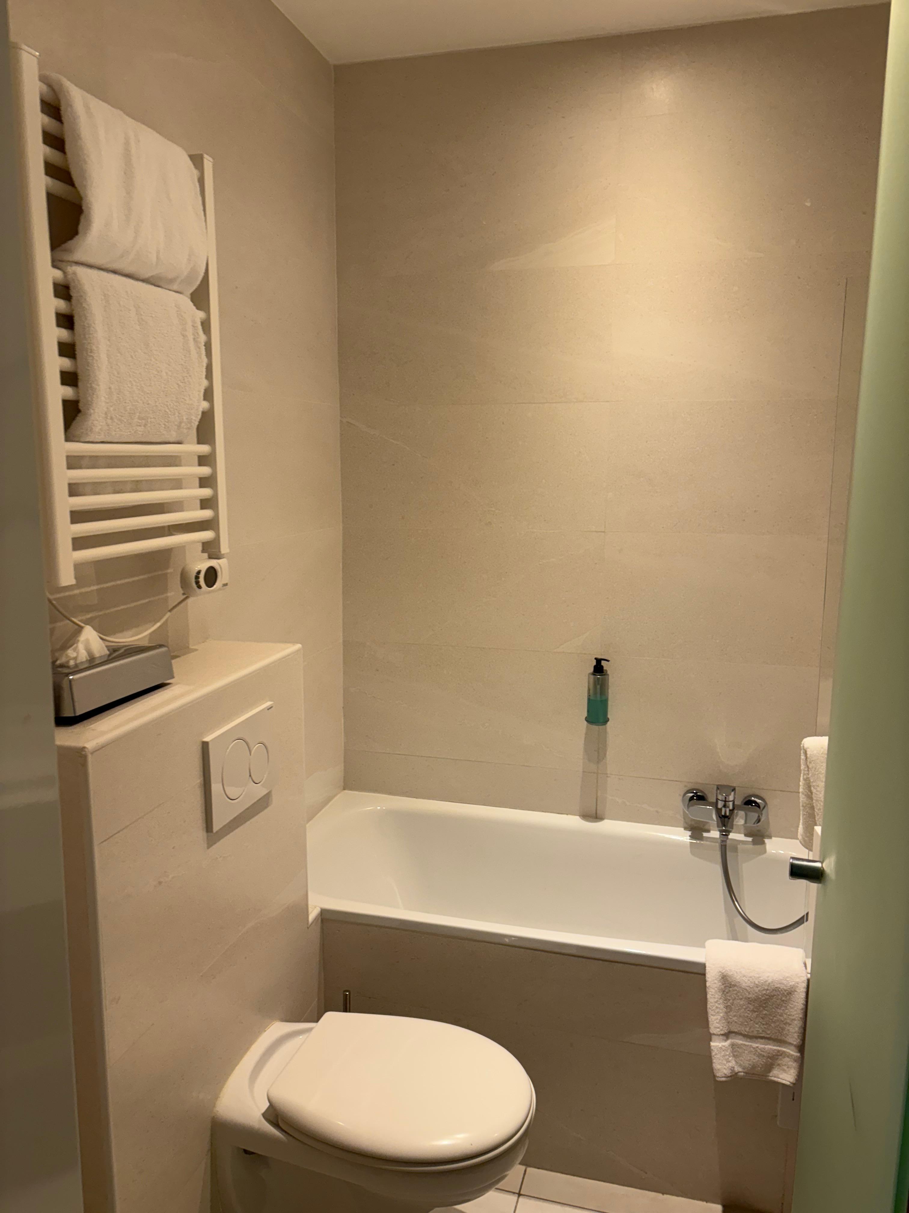 Bathroom. shower could be busy not much for partition. Towel warmer!
