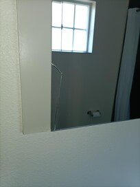 The mirror is cracked in the lower left corner. Which is fine but I'm not paying for that, It was like that when I got here.