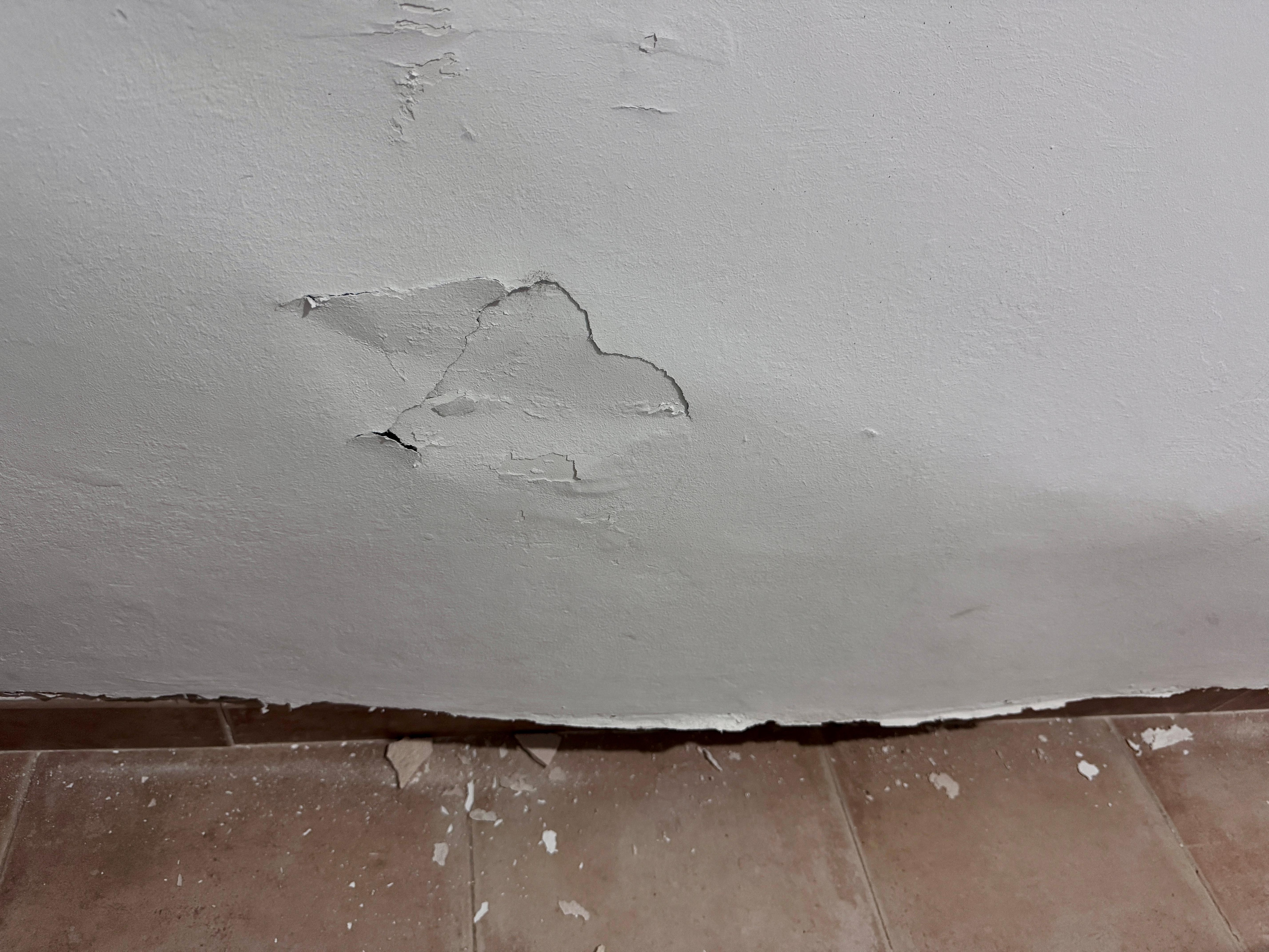 Cracks and masonry pieces from the bedroom wall.
