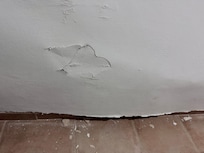 Cracks and masonry pieces from the bedroom wall.