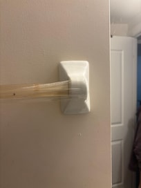 Bath towel held together by packing tape