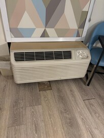 broken tile below A/C unit