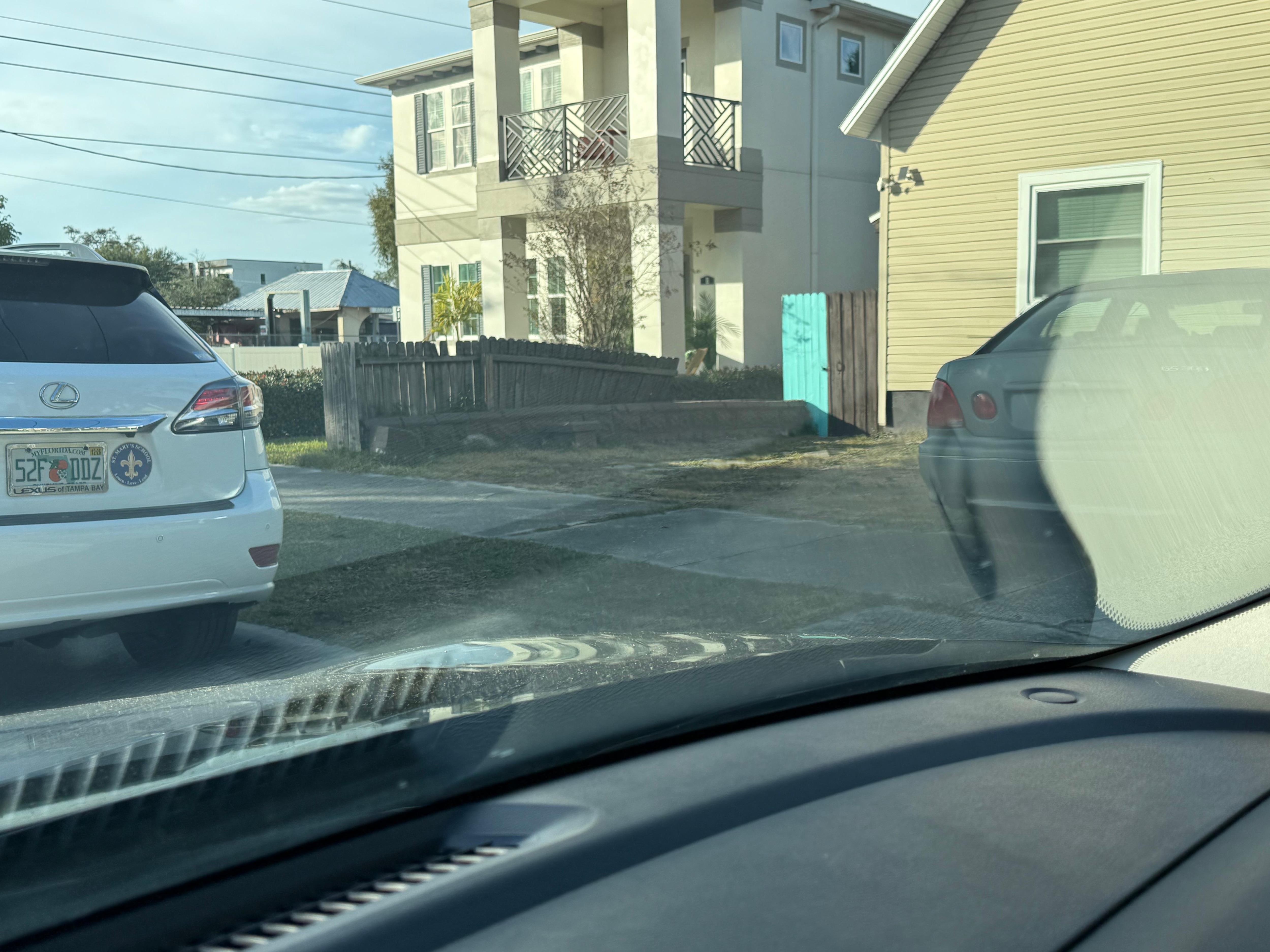 A car was on the road so I was unable to squeeze in behind junk car to even get into my parking space on this day