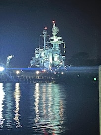 View of USS NC at night from the balcony.