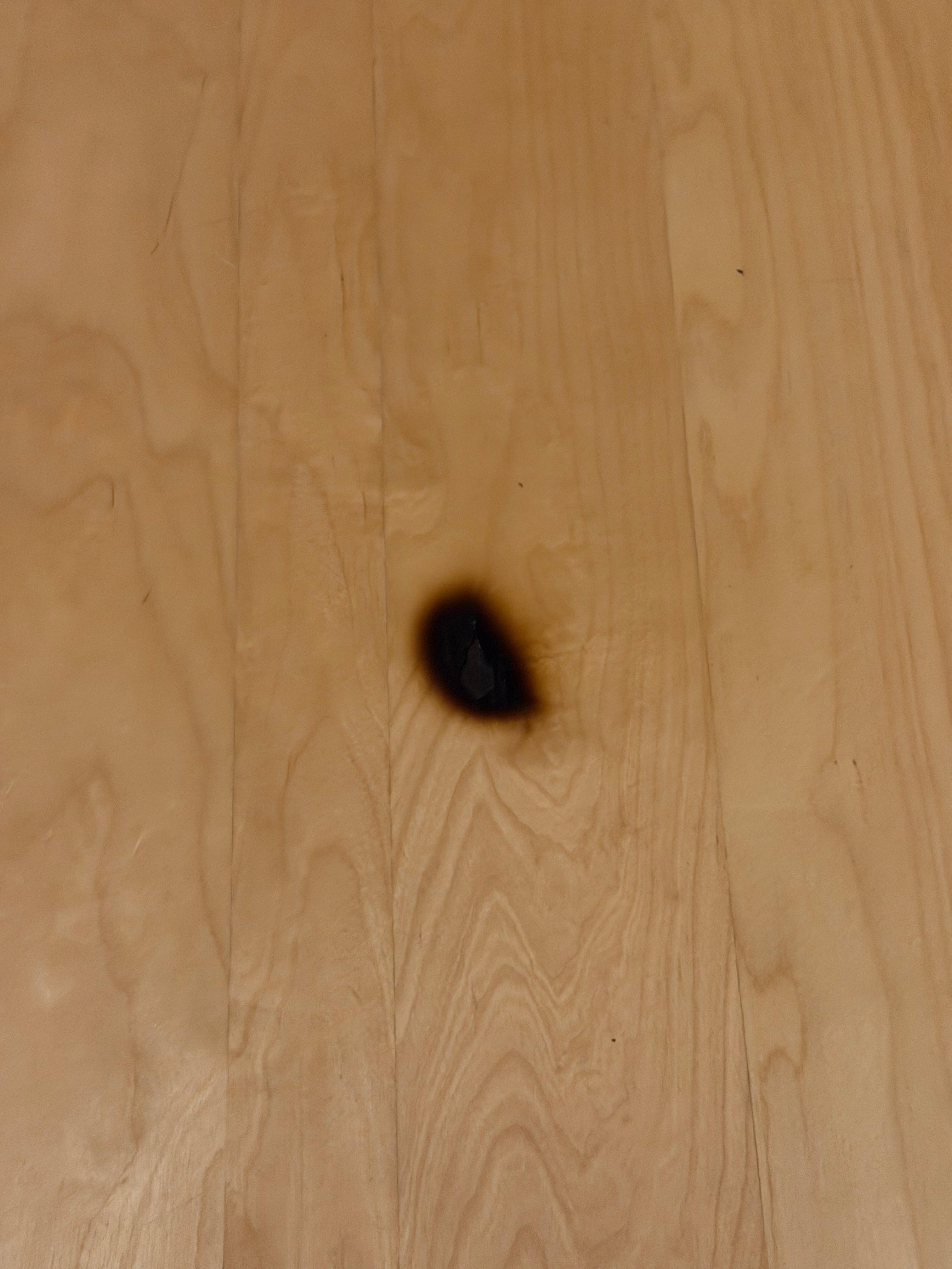 Burn on bedside table.