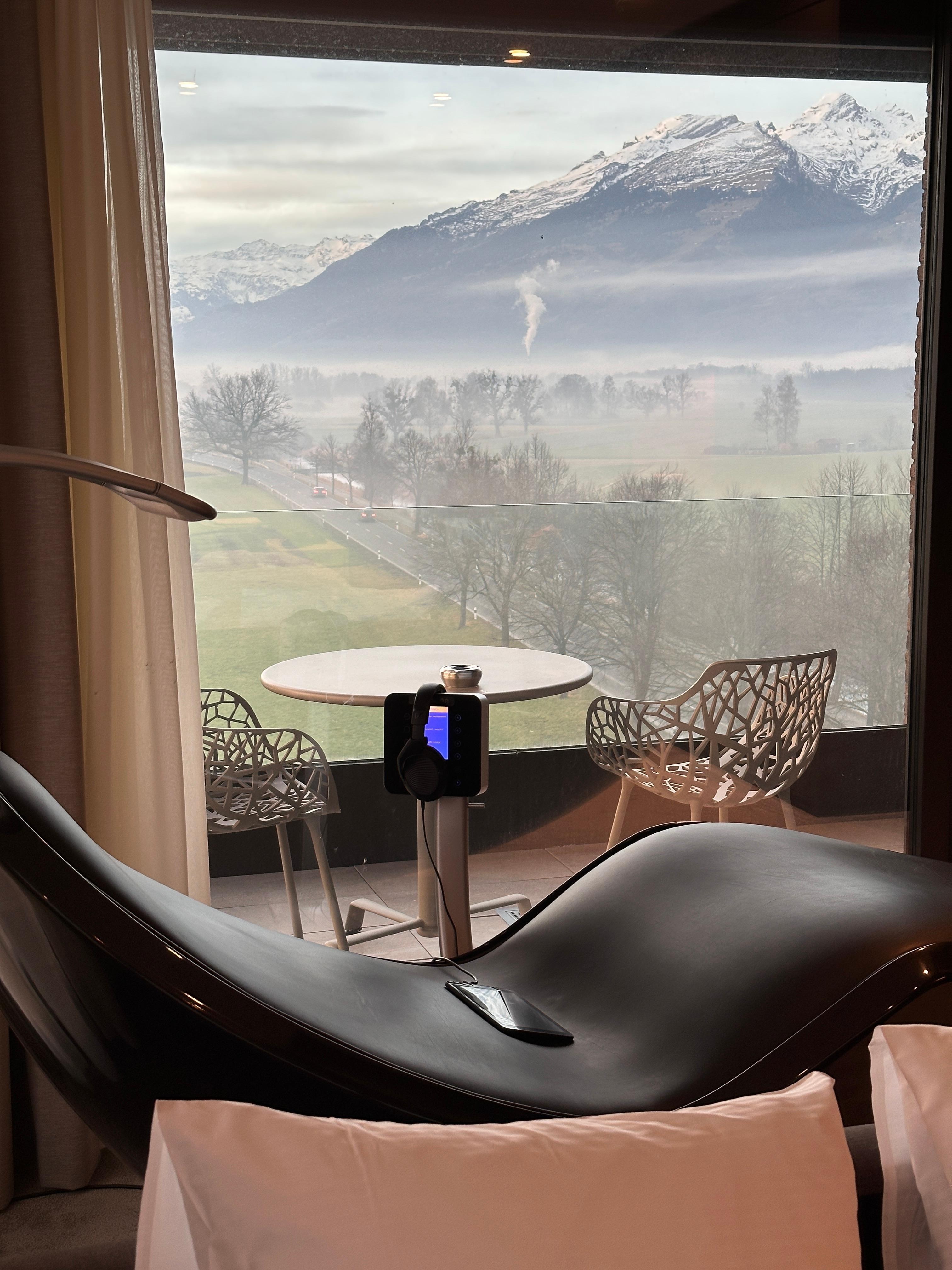 View to the mountain through Wellness chairs and balcony 