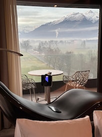View to the mountain through Wellness chairs and balcony