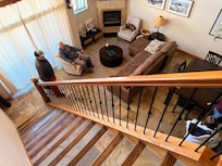 Looking down to family room from loft