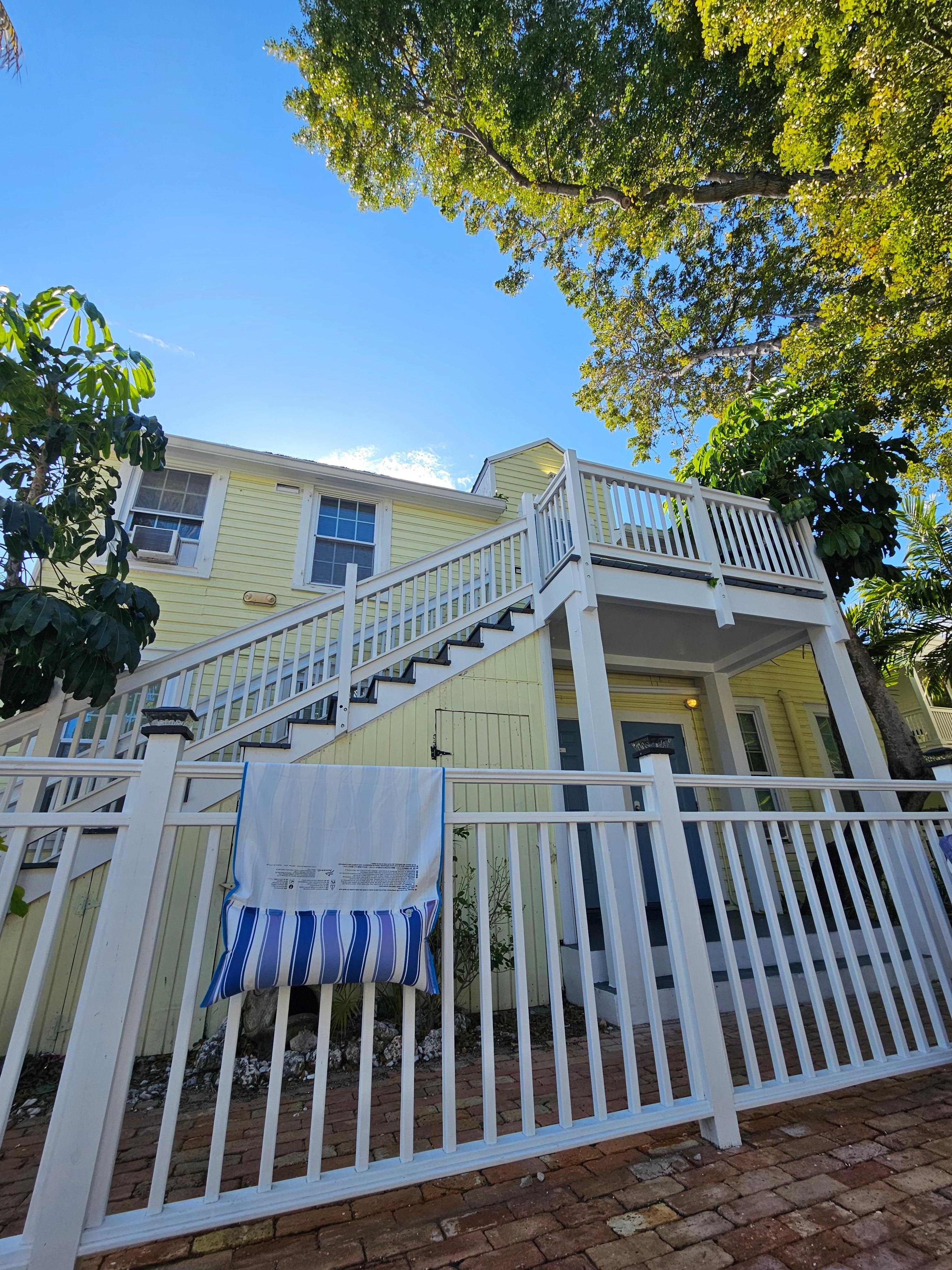 View from the pool. The unit is at the top of the stairs.