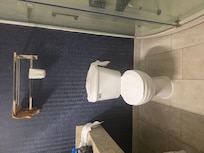 No ADA grab bars at toilet