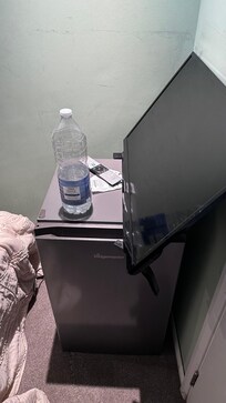 TV resting on the fridge