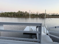 Quiet evening enjoying the deck over the water.