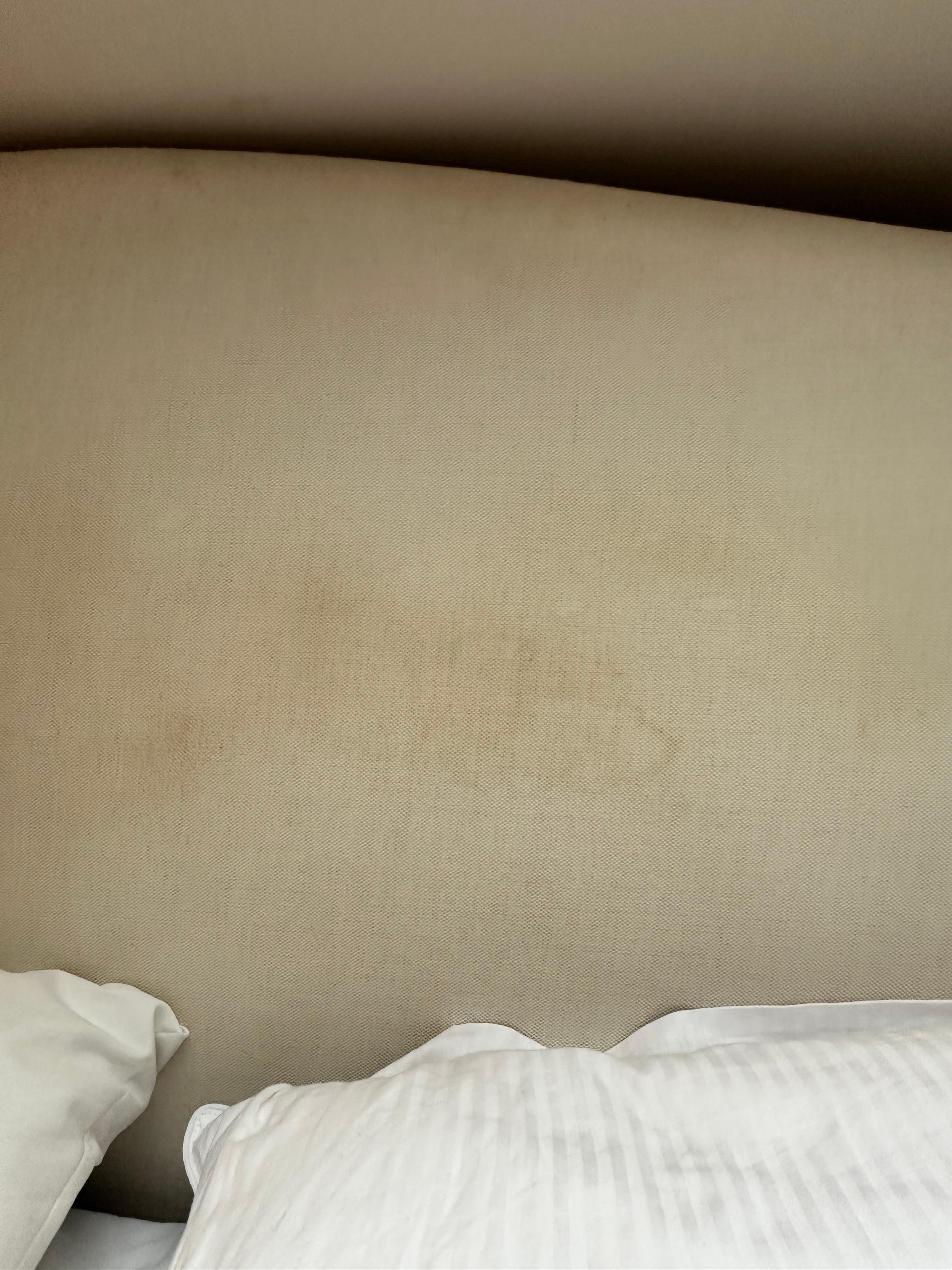 Filthy headboard on the bed