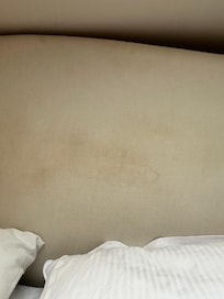 Filthy headboard on the bed