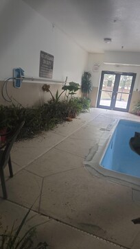 Pool is closed till May, no water and dying plants.