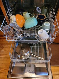 Dirty dishes found in dishwasher upon arrival.
