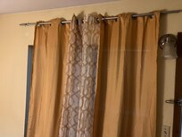 Three shower curtains trying to double as drapes - no typical 'blackout' drapes.