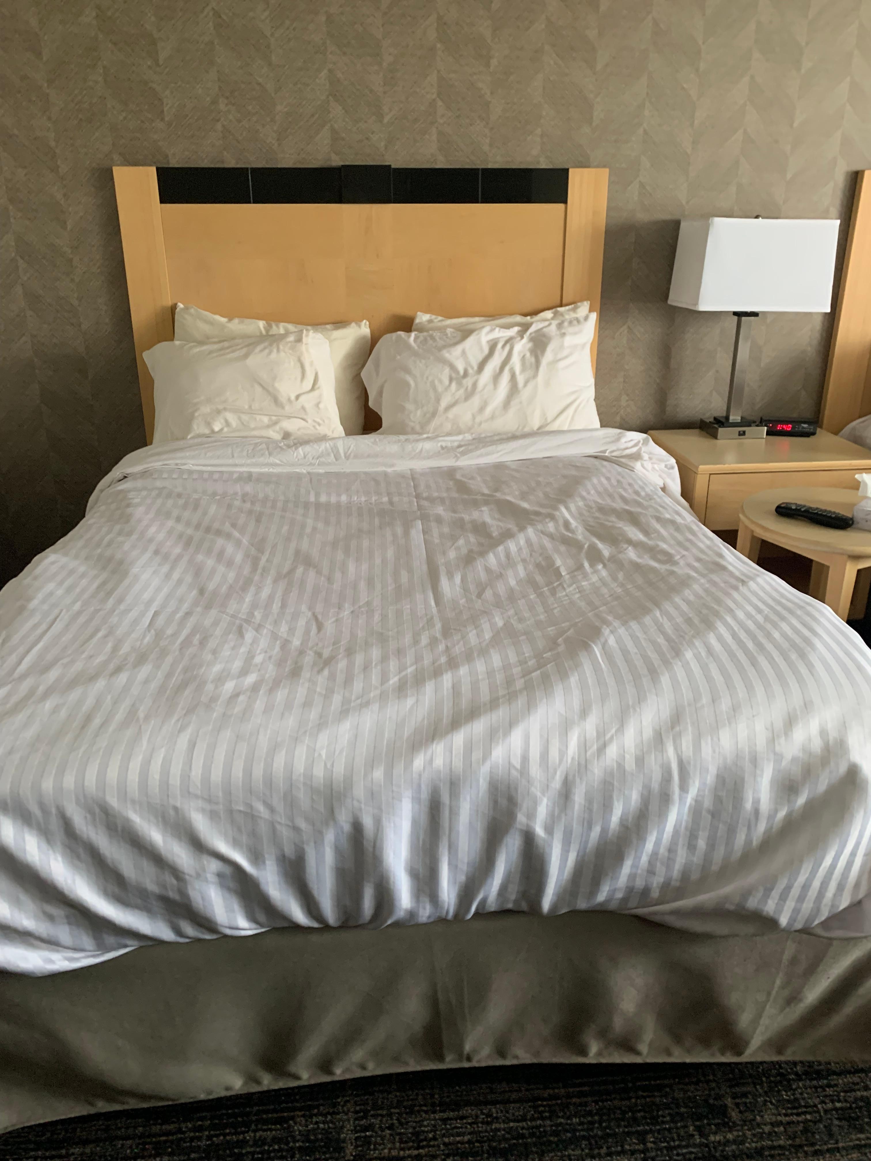 This is how the bed looked after cleaners “made it up”