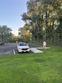 Playing ball right in the parking lot