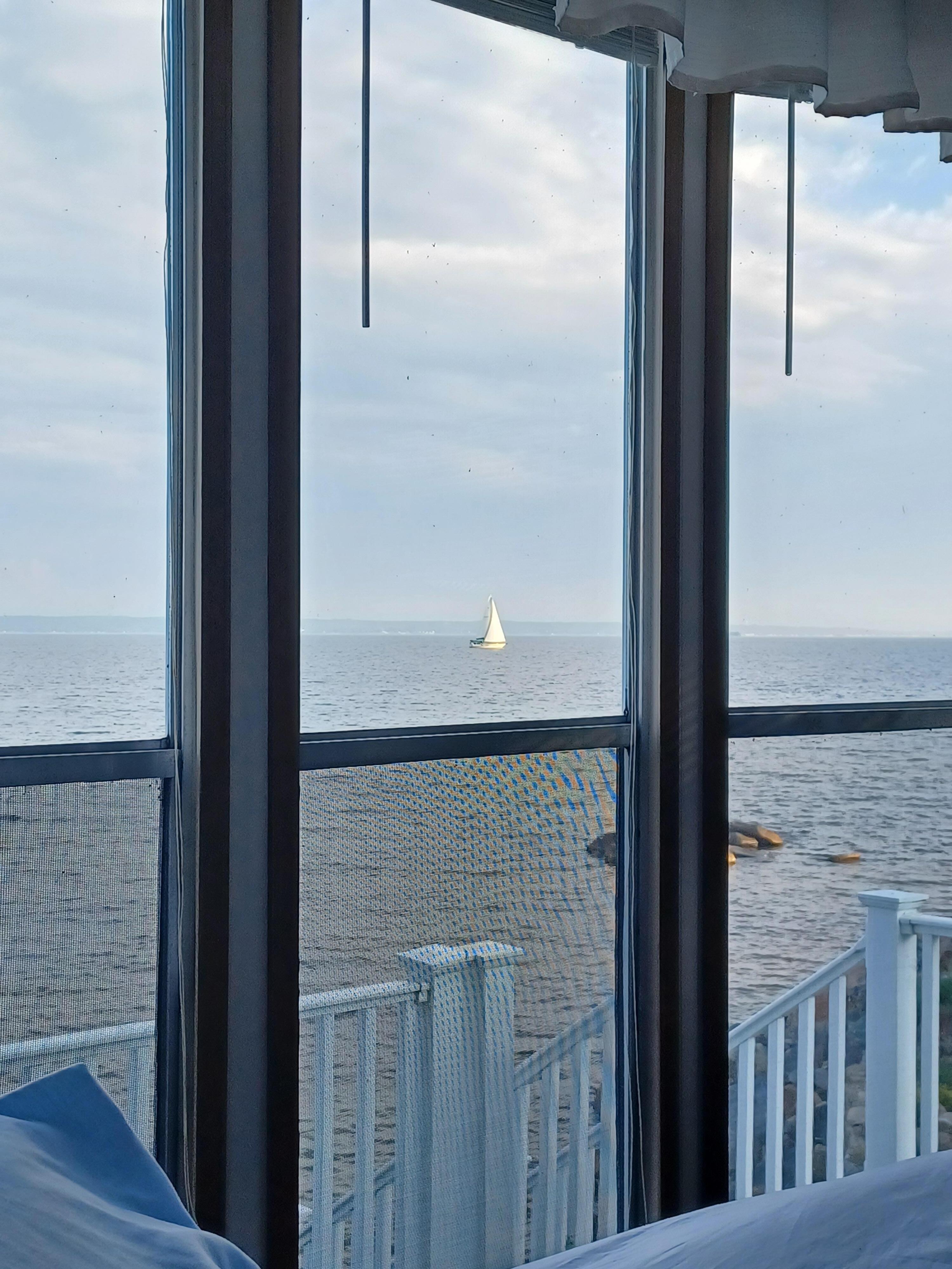 You can watch the sailboats from the living room! 