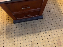 Stains on the carpet, busted dresser.