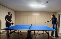 Playing ping pong.
