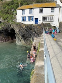 The Mad Maids of Polperro enjoying their year round swim in the ocean!