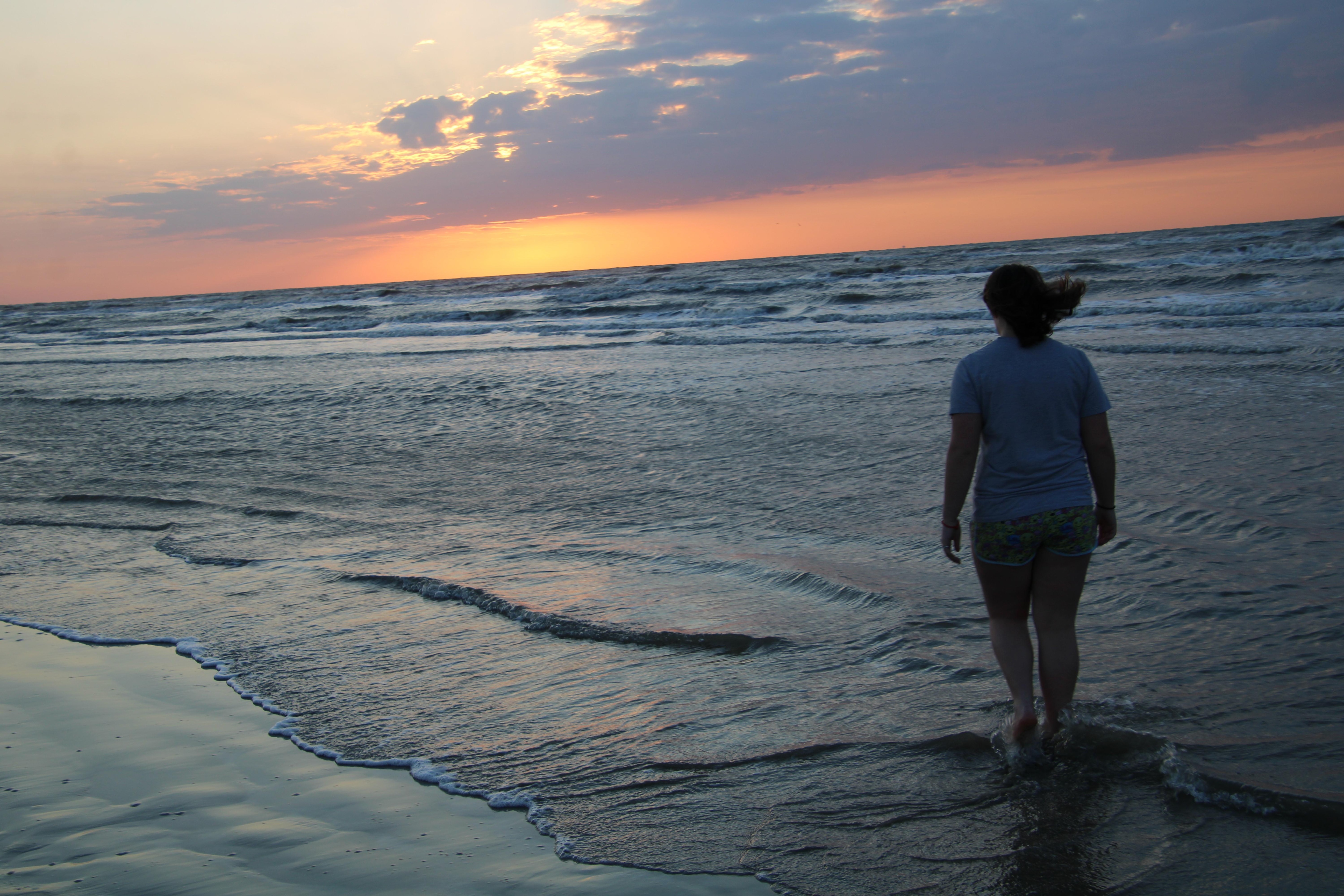 Toes in the sand at sunrise.