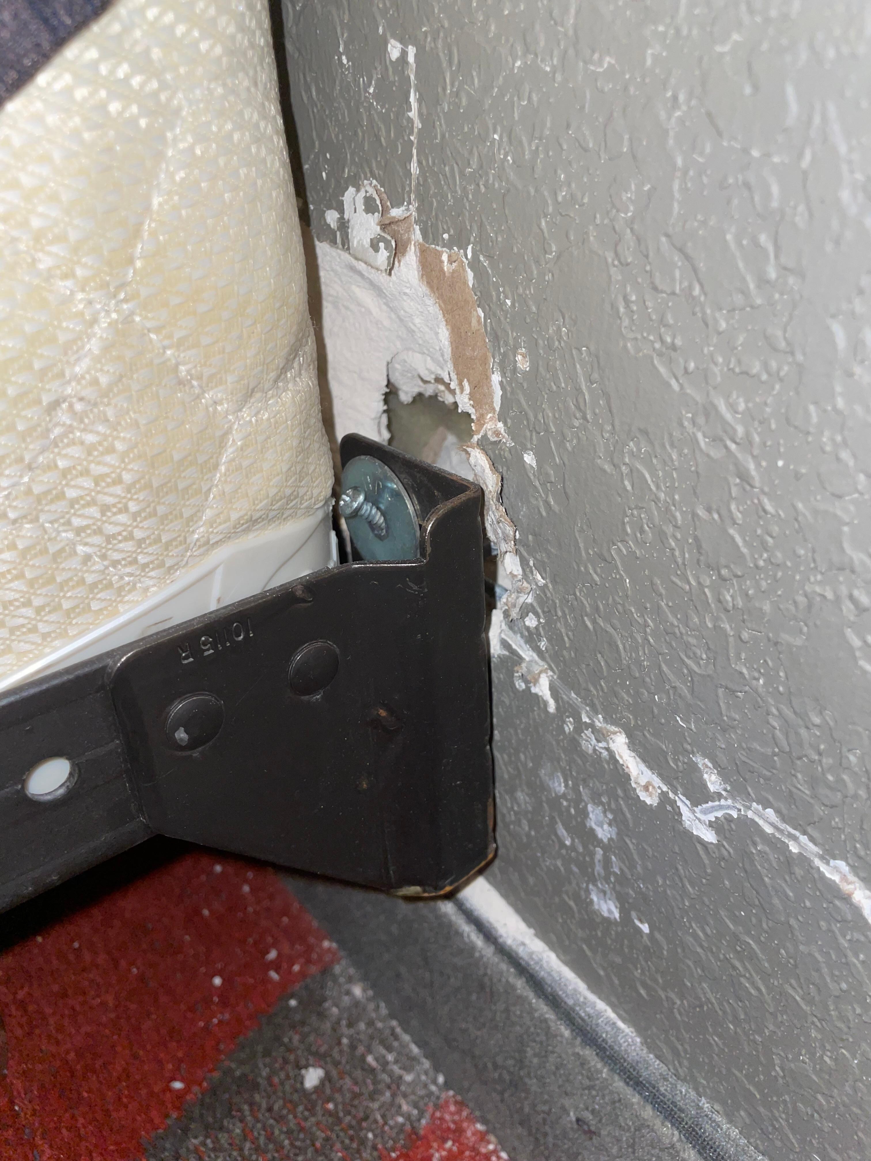 The bed had holes behind each side and this one was the biggest. 