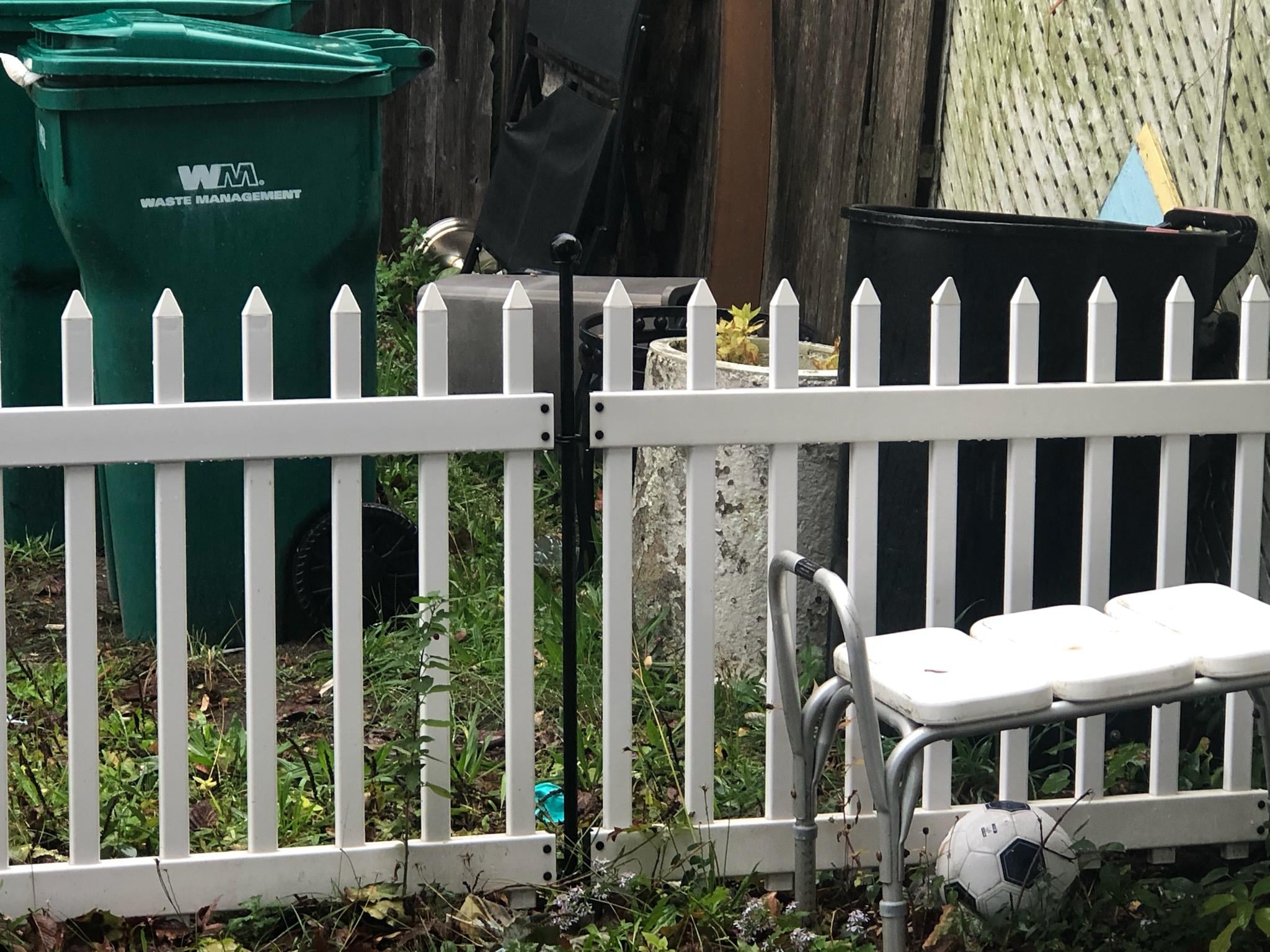 trashcans and shower chair. 