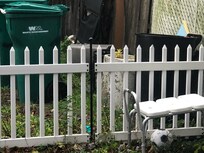 trashcans and shower chair.