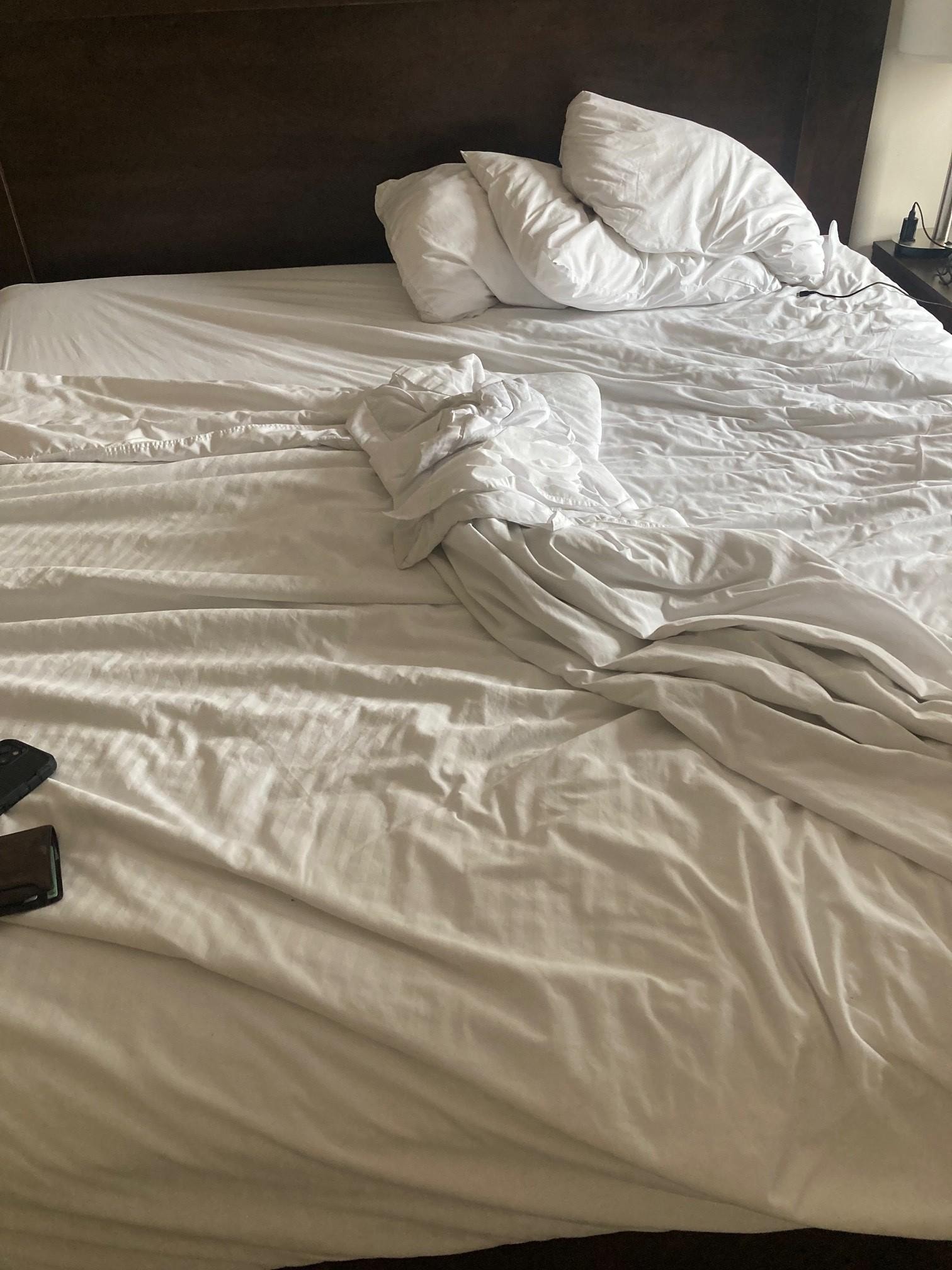 bed with no bedspread.