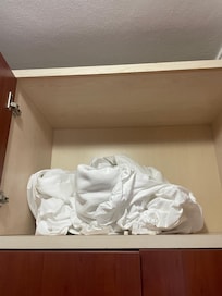 the dirty changed sheets were crammed into the closet