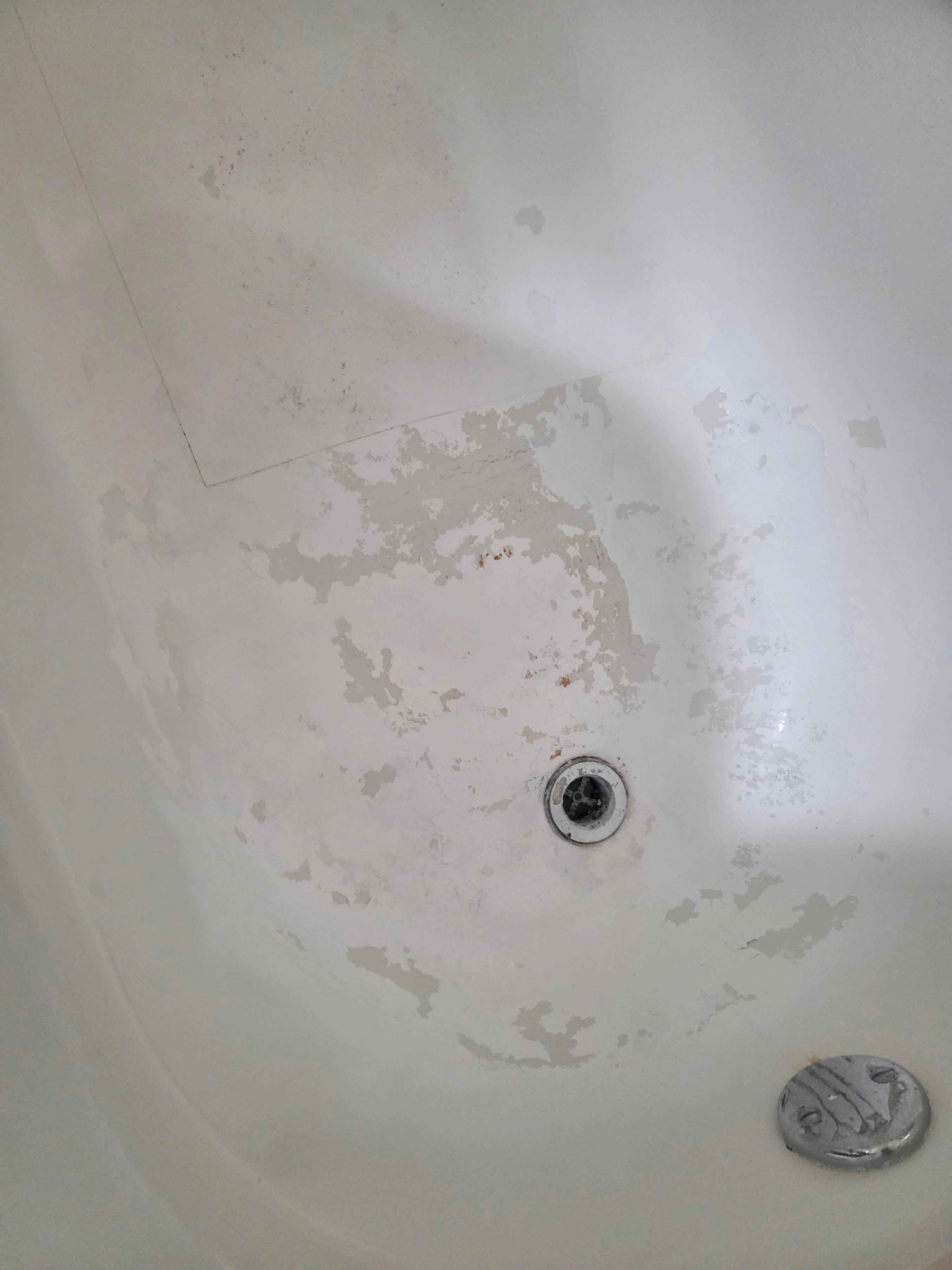 Chipped shower with rust spots