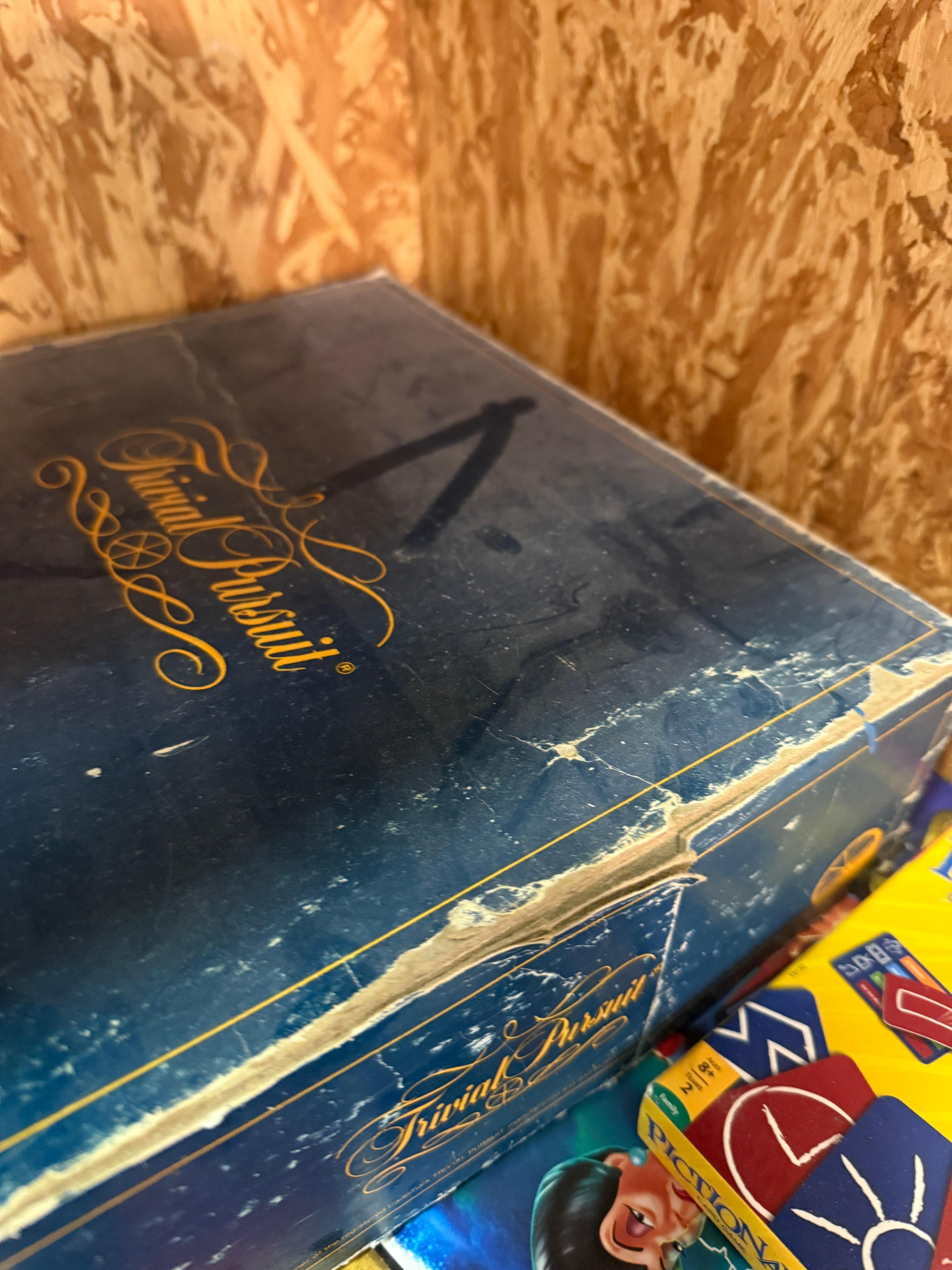 Primary bedroom closet, games covered with dust.