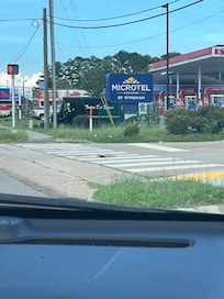 Approach to hotel where there are a lot of what appear to be homeless people