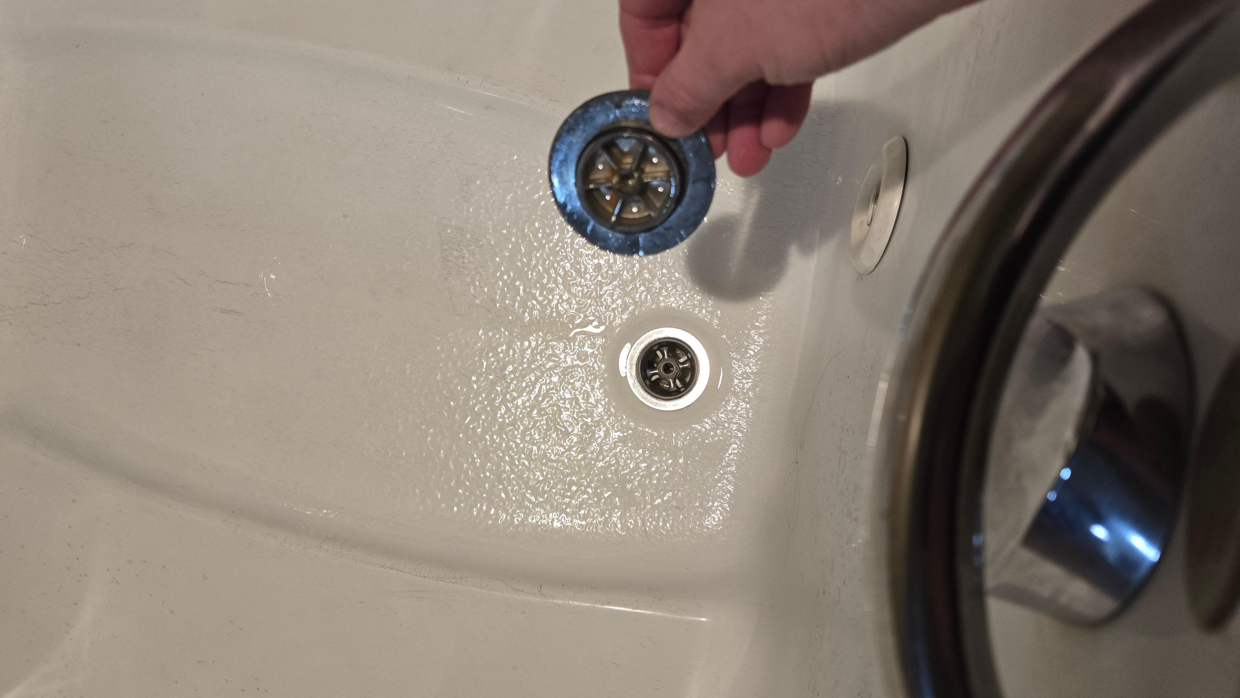 Good luck keeping the one shot at hot water you may get inside the tub.