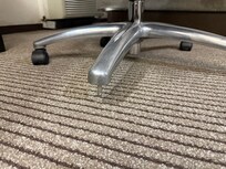 Office chair missing a leg, almost fell down