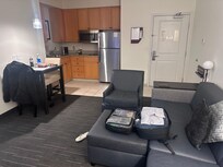 Nice studio with couch and small kitchen.