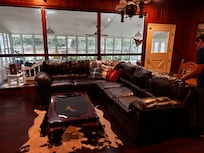 Super comfortable leather couch invites you to read a book and take a nap or converse with family.