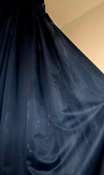 Grime and stains on the curtains.